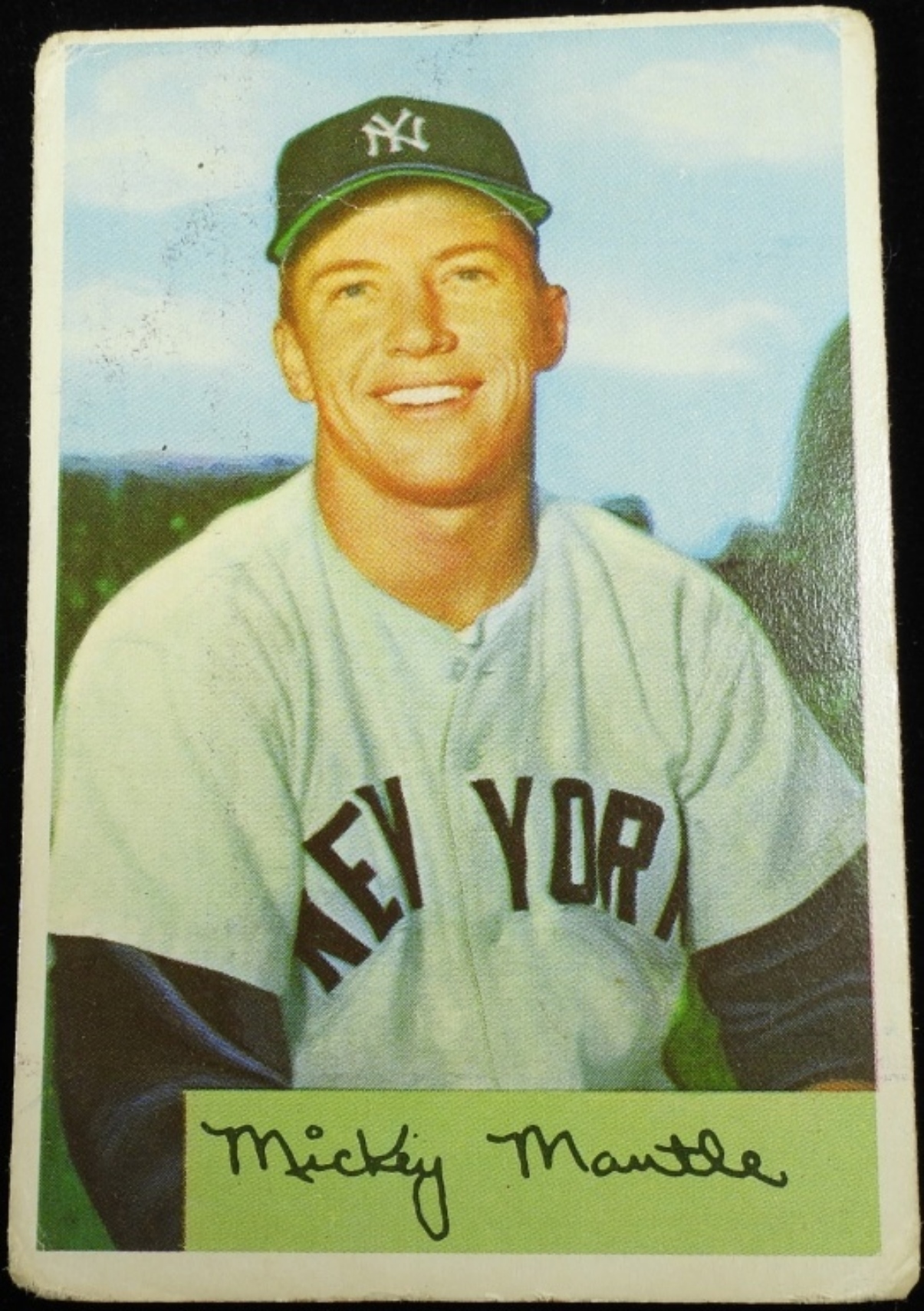 Mickey Mantle baseball card featured in October 7 sports memorabilia auction.