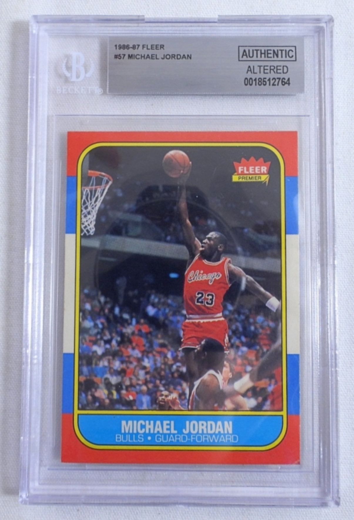 1986 Fleer Michael Jordan basketball card graded by Beckett, featured in a sports memorabilia auction showcasing rare and collectible cards.